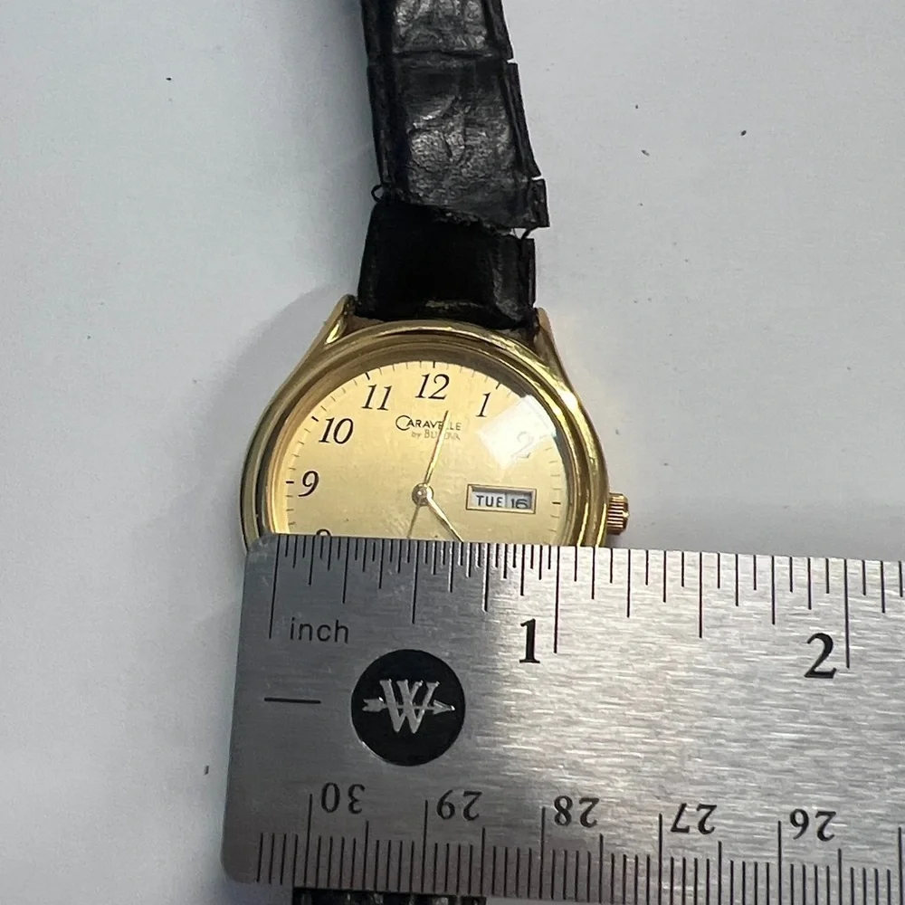 Caravelle by Bulova Vintage Quarts Watch Day Date Second Hand Function